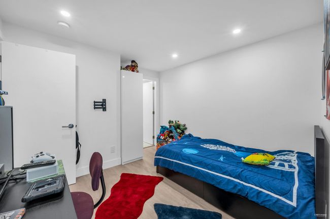 Bedroom with baseboards, recessed lighting, and wood finished floors | Image 6