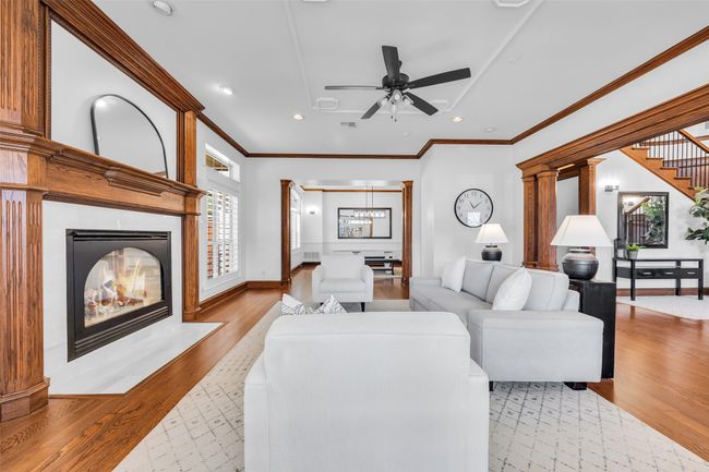 Formal living room at the front of the house has a gorgeous fireplace | Image 10
