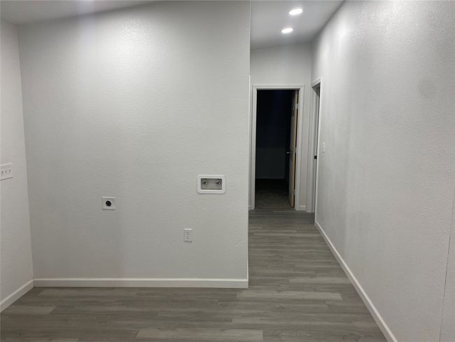 Corridor featuring wood finished floors, baseboards, and recessed lighting | Image 16