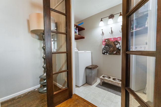 Laundry room featuring washer / clothes dryer and light wood-type flooring | Image 8