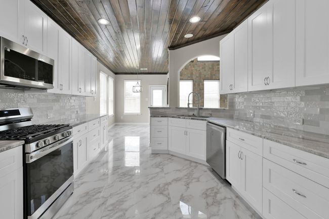 Kitchen and breakfast area straight with the back door. | Image 15
