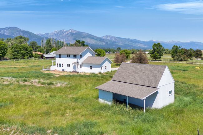 Aerial view of property and surrounding area featuring mountains | Image 55