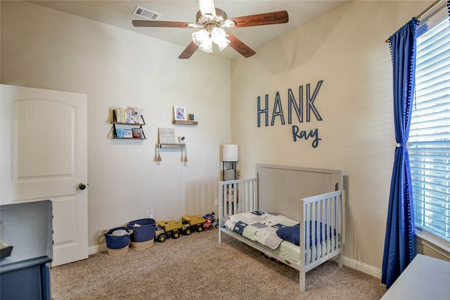Bedroom featuring a ceiling fan, and carpet floors | Image 26