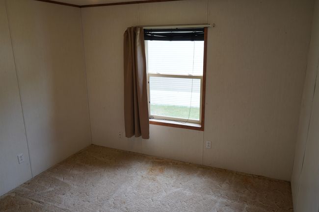View of carpeted spare room | Image 15