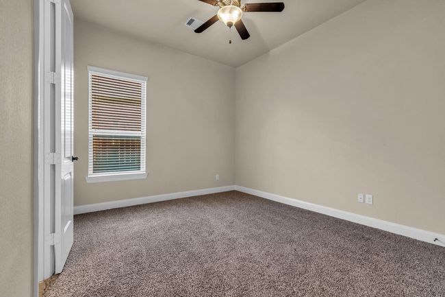 The first of two charming twin bedroom suites which are connected by a shared full bath, offering the perfect layout for siblings or guests. | Image 24