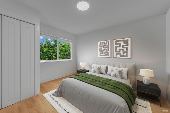Bedroom featuring baseboards and wood finished floors | Image 17