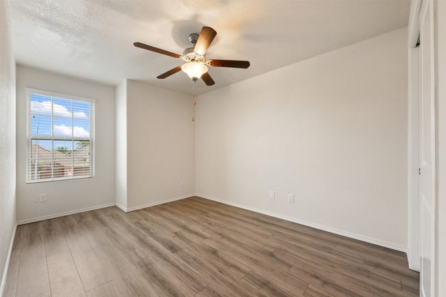 Spare room with wood finished floors, a ceiling fan, and baseboards | Image 28