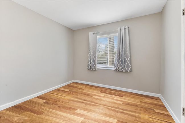 Bedroom featuring light wood-style floors | Image 16