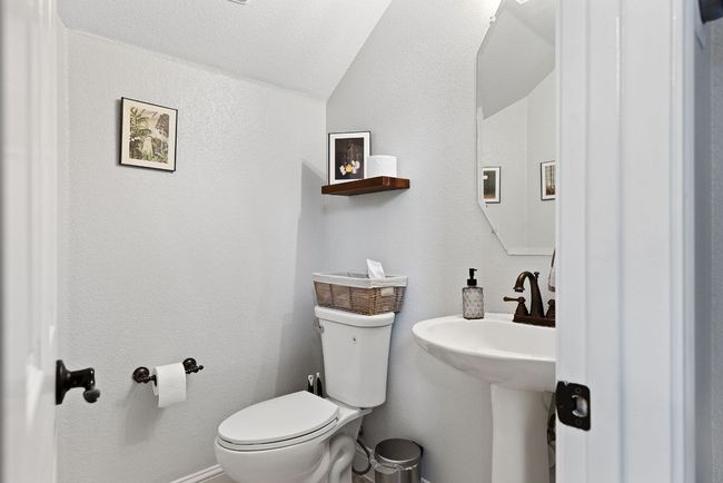 Half bath located on the main floor. | Image 19