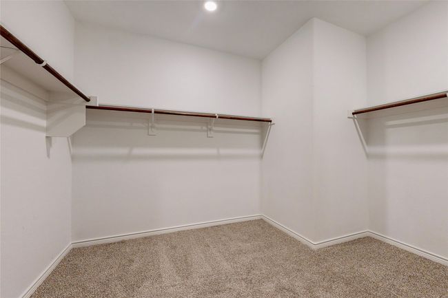 Spacious closet with carpet flooring | Image 37