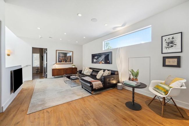 The upstairs living/flex space is perfect for kids to play, unwind with a family movie night, or simply relax while enjoying your favorite music. A versatile area designed for connection, comfort, and fun. | Image 27