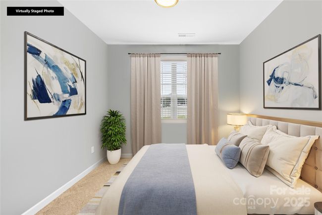 virtual staged main floor bedroom | Image 9