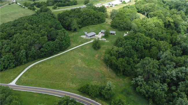 View of property location featuring a heavily wooded area | Image 62