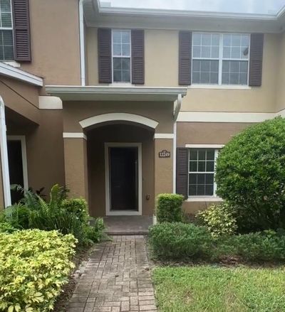 12249 John Wycliffe Boulevard, Townhouse with 2 bedrooms, 2 bathrooms and null parking in Orlando FL | Image 1