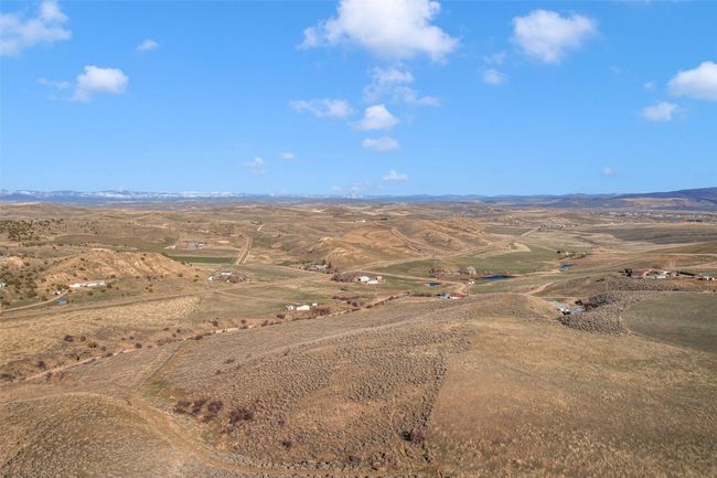 Aerial view of sparsely populated area featuring mountains | Image 21