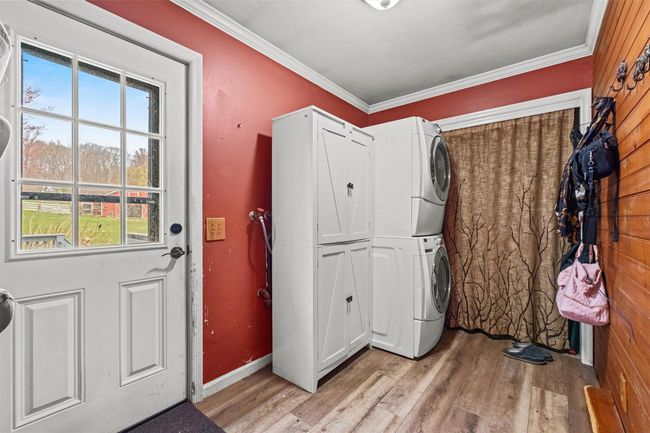 W/D, closet and entrance to the deck from the mudroom | Image 24