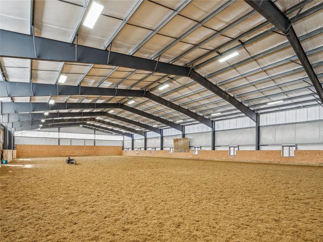 Insulated indoor arena with geotextile/silica footing provides all weather access | Image 23