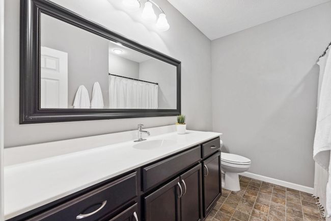 Full-bath in the basement- check out that large vanity! | Image 29