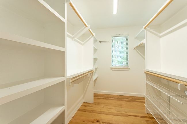 Spacious closet featuring light wood finished floors | Image 23