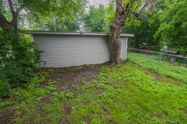 View of yard with fence | Image 12