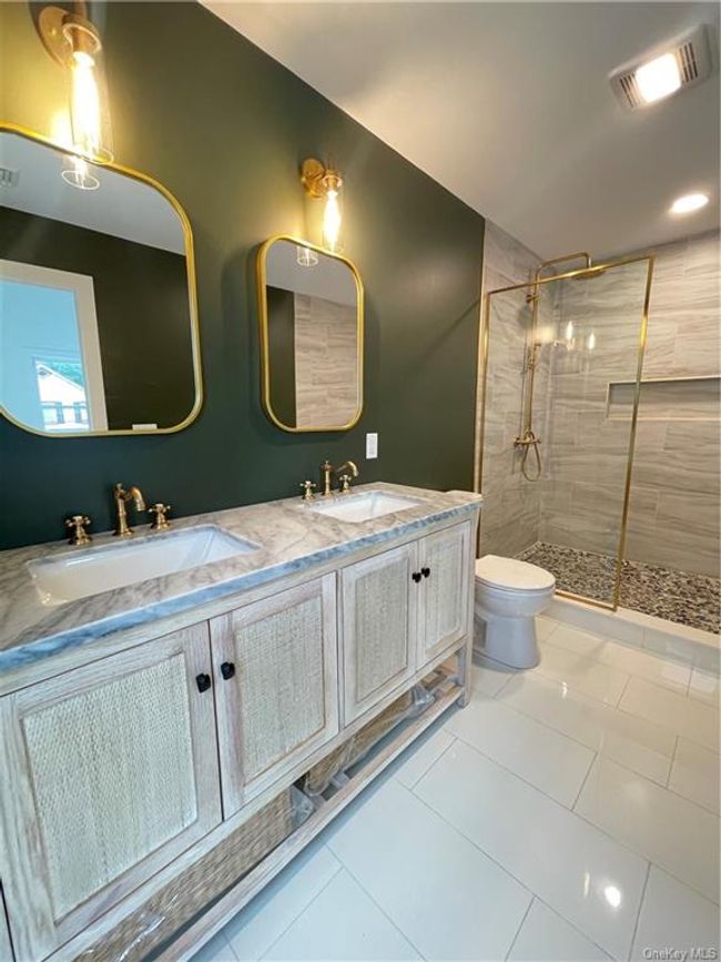 Example of the work we do. Not this house. Bathroom featuring tile patterned floors, double vanity, walk in shower, and toilet | Image 16