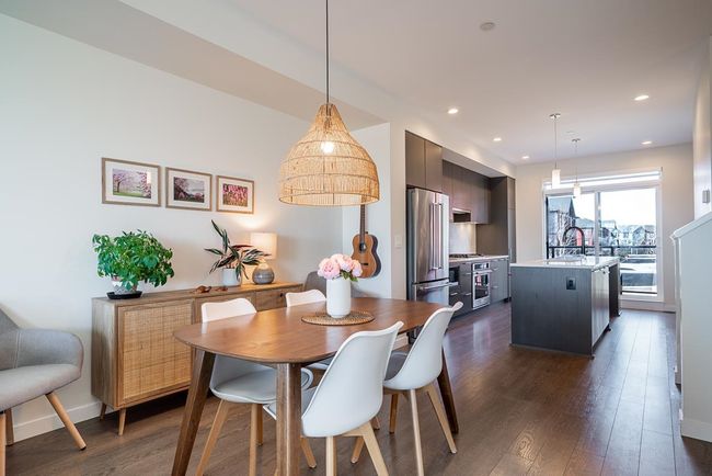 Dining area with recessed lighting, baseboards, and dark wood-type flooring | Image 12