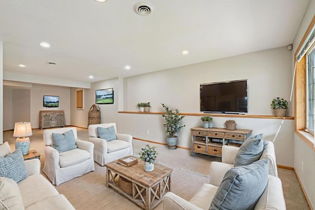 Large (34x13) walkout lower level family room, freshly painted, new carpet, outside leads to back patio, recessed lights. (virtually staged) | Image 10