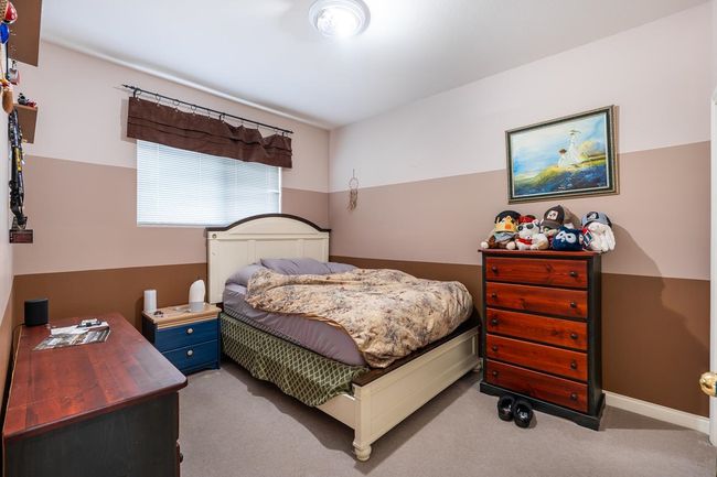 Bedroom featuring baseboards and carpet floors | Image 28
