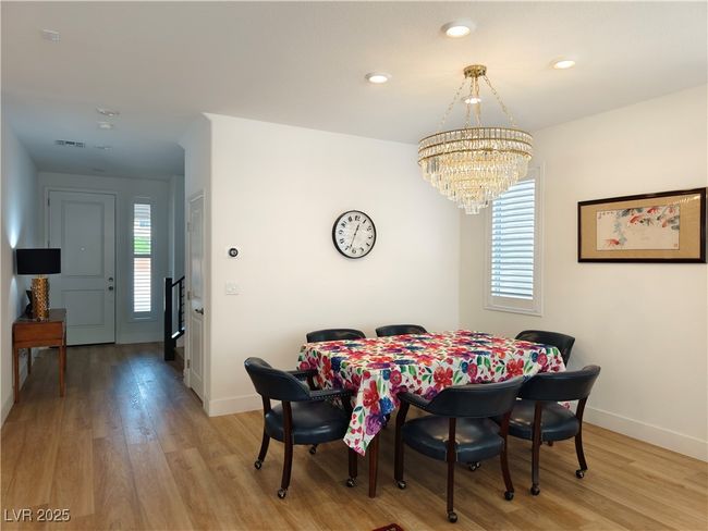 Dining space featuring baseboards, recessed lighting, a chandelier, and light wood-style flooring | Image 7