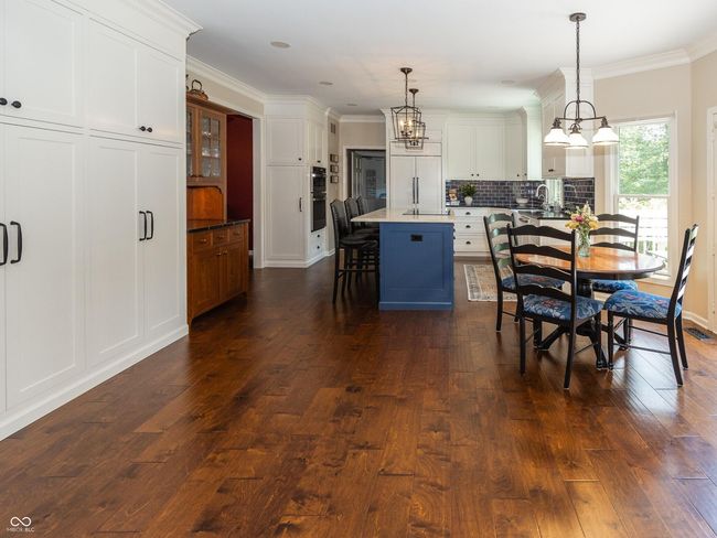 Recently Renovated Kitchen Featuring High End Appliances Including Sub Zero Refrigerator, Beautiful Quartzite Counter Tops | Image 8