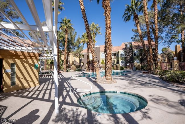Pool featuring a patio, fence, a hot tub, and a pergola | Image 29