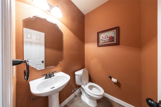 Bathroom with toilet and tile patterned flooring | Image 18