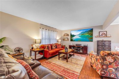 Living room featuring hardwood / wood-style floors | Image 3