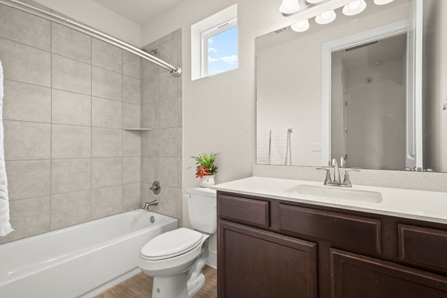 Full bath with vanity, shower / bath combination, and wood finished floors | Image 6