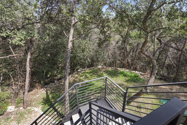 Wooden deck featuring a view of trees | Image 24