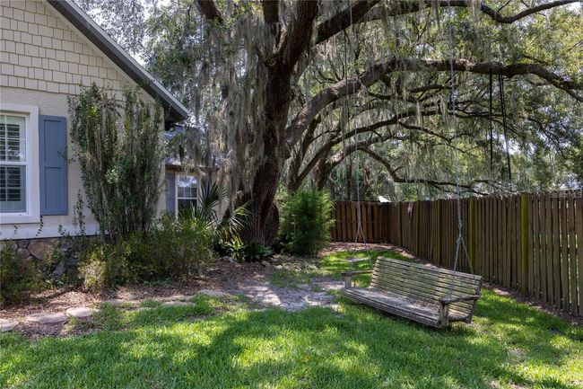 Mature lush landscaping creates homey feelings all around! | Image 30