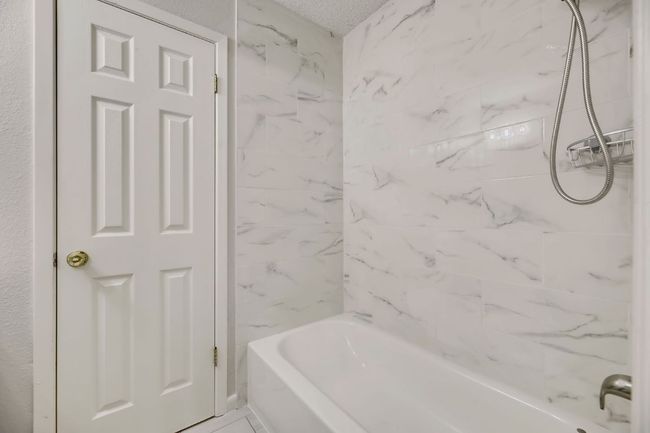 Primary bath with updated fixtures on main floor | Image 6