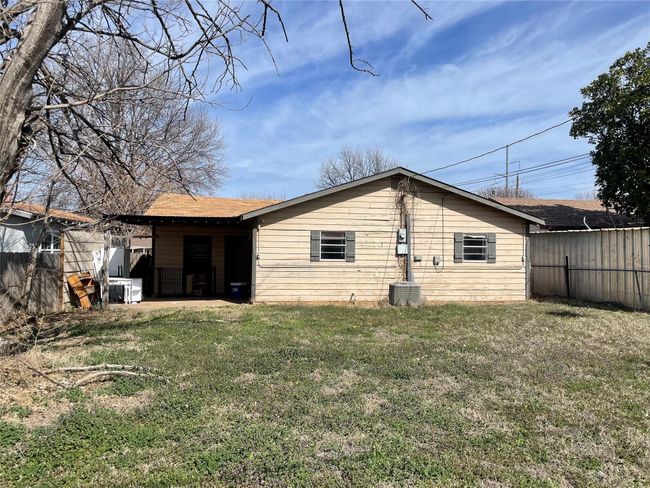 Back of house with a shingled roof | Image 9