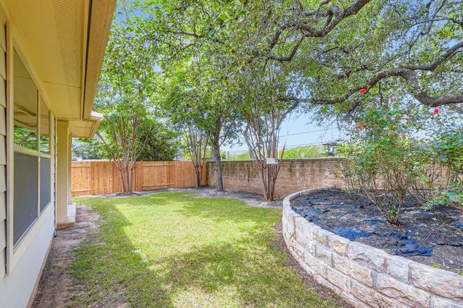 View of fenced backyard | Image 29