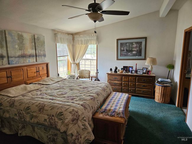 Bedroom with lofted ceiling and ceiling fan | Image 9