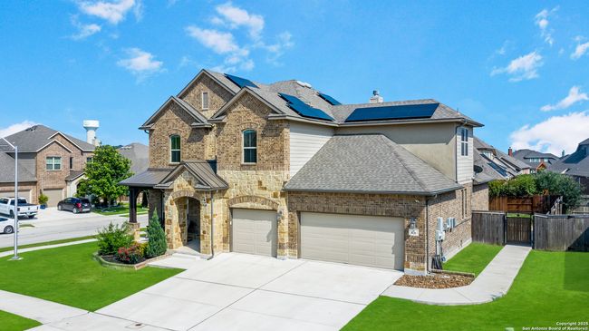A stunning exterior shot of the home set against a | Image 6