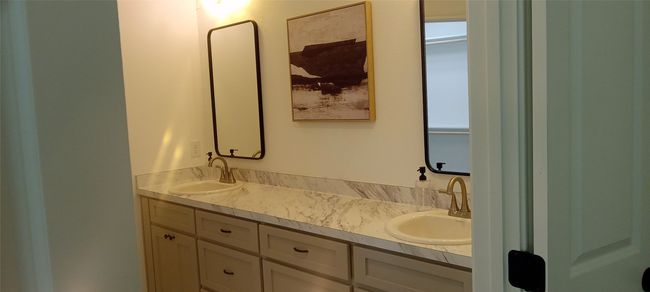 Bathroom featuring double vanity | Image 8
