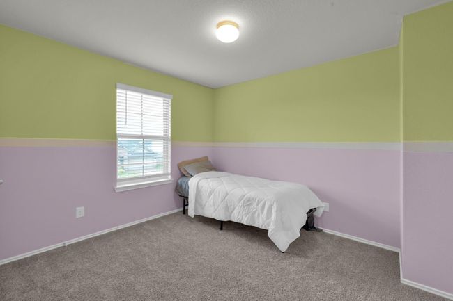 Alternative view of the 3rd bedroom highlights the amble natural light that beams in through the window. | Image 26