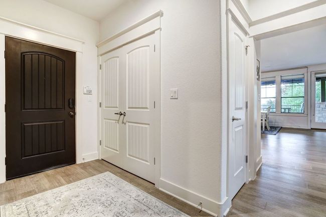 Foyer with wood finished floors and baseboards | Image 6