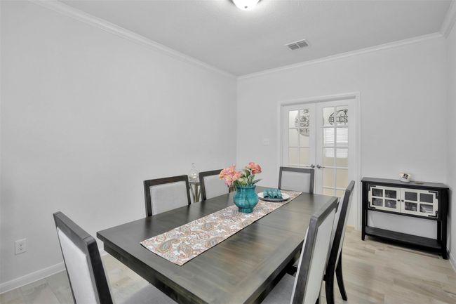 Dining room with ornamental molding and baseboards | Image 4