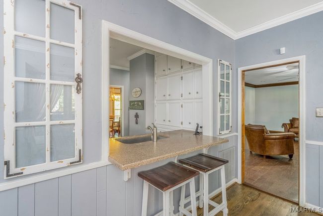Breakfast room bar opens to kitchen | Image 22