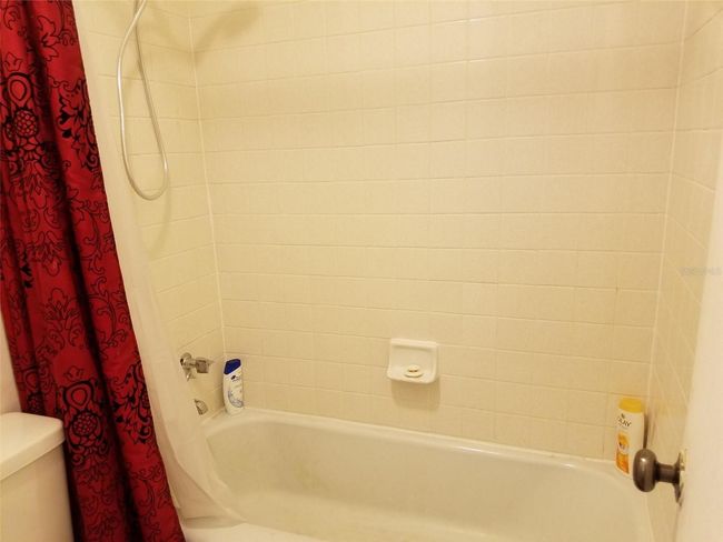 shower tub with redone grout | Image 16