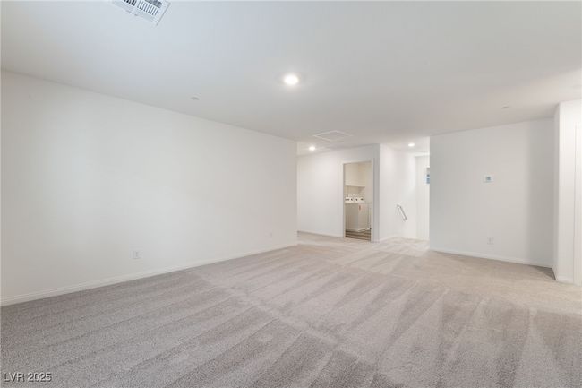 Unfurnished room with recessed lighting, light carpet, and washer / clothes dryer | Image 15