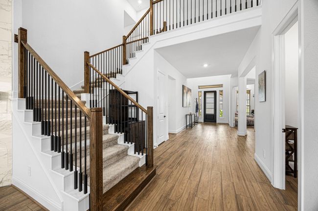 These beautiful stairs lead us to 3 bedrooms, 2 baths, game room and media room. | Image 16