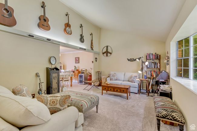 Living room with vaulted ceiling and carpet flooring | Image 24
